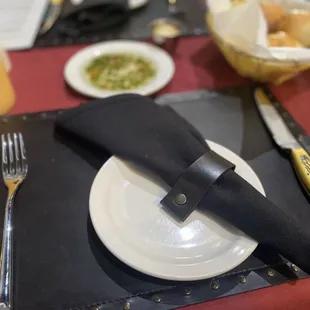 Place setting with bread &amp; delicious dipping oil.