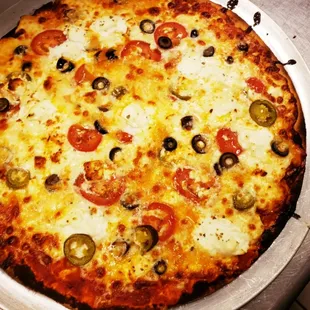 Tomato, black olive, jalapeno, fresh mozzarella pizza