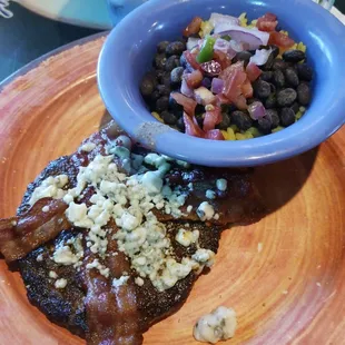 Blue cheese and bacon burger no bun with a side of black beans and rice
