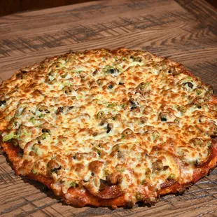 a pizza on a wooden table