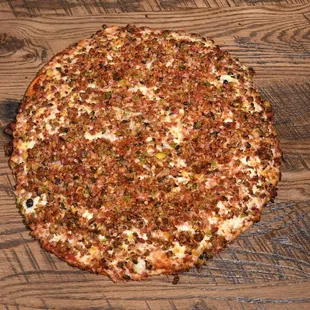 a pizza on a wooden table