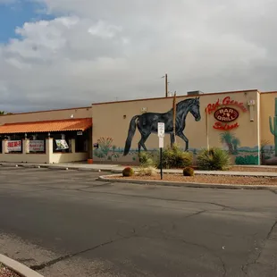 a horse painted on the side of a building