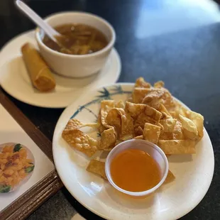 a plate of food and a bowl of soup