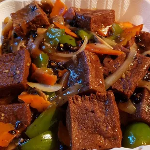 Chow fun w/black bean sauce ($13.50 + $1.50 for tofu). Not on menu, but they'll make it for you. Overcooked noodles. Meh overall.