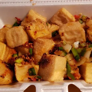Salt and pepper tofu ($12). Vegan by default. Doesn't travel well. Weirdly bland and unsatisfying.