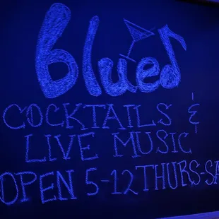 Small bar in rear of restaurant with craft cocktails and live music