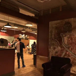 a man standing in front of a bar