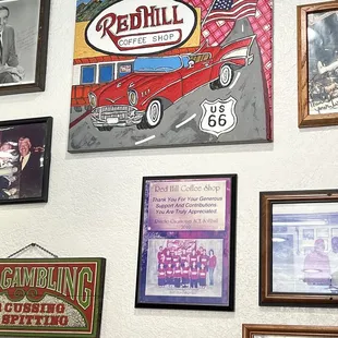a wall of framed photographs