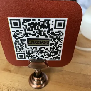 a qr code on a wooden table