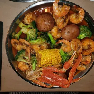 shrimp, broccoli, corn and potatoes