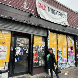 Sporting my new hat in front of the shop