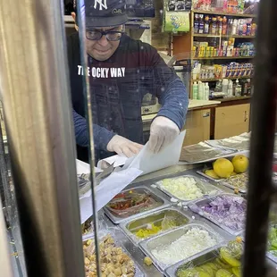 a man preparing food in a restaurant