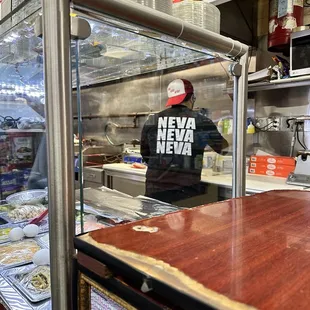 a man preparing food in a restaurant