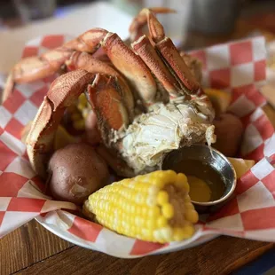 crab legs, corn and potatoes