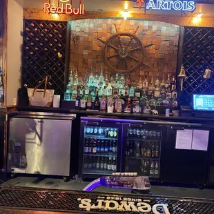 a bar with several bottles of alcohol