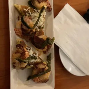 Bacon wrapped shrimp Over polenta. Sexy / chic.