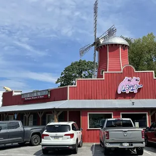 a windmill on a red building