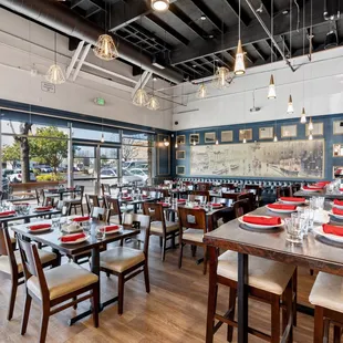 a dining room with tables and chairs