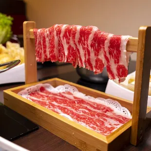 a piece of raw meat on a rack