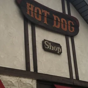 a sign for a hot dog shop