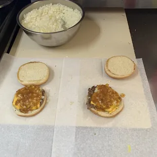 three hamburgers with a side of rice