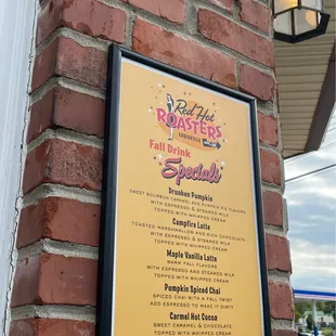 a sign on a brick wall