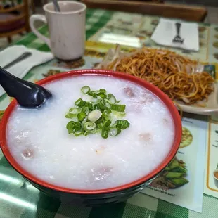 breakfast combo E, $9.50, beef porridge, soy sauce chow mein and milk tea.