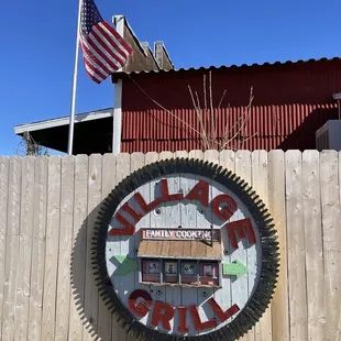 On the side by the parking lot