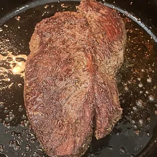 Dry Aged Hanger steak Searing in cast iron simply seasoned with Kosher salt and Cracked pepper...