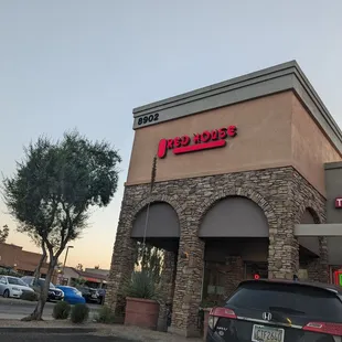 a car parked in front of a restaurant