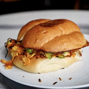 Torta: Bolillo sandwich, Mexican chorizo, scrambled eggs, avocado, tomatoes, onions