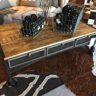 Beautiful industrial like coffee table we were thinking of getting. Love the vintage couch behind it too!