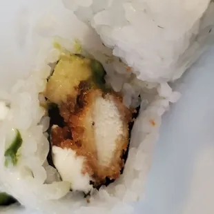 a plate of sushi rolls