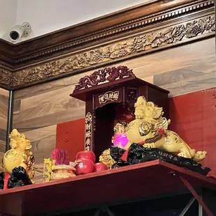  a shelf with a buddha statue