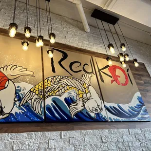  a mural of koi fish and waves