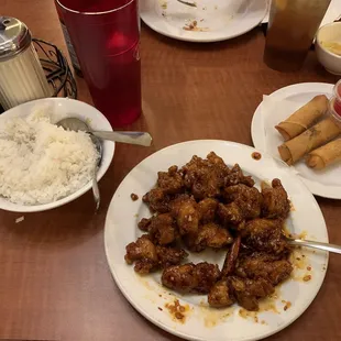 a table with plates of food and drinks