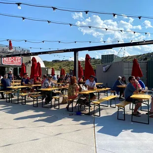 outdoor patio with tables and umbrellas