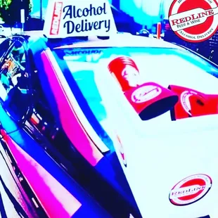a car with alcohol delivery sign