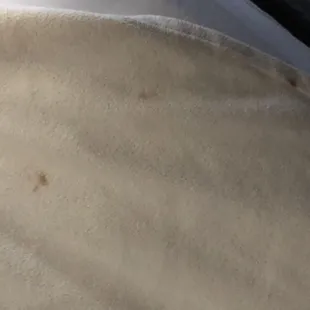 Stains on bedspread.