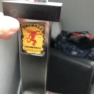 Whisky sticker on bedside lamp from prior guest.