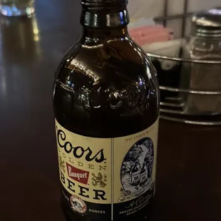 a bottle of beer on a table