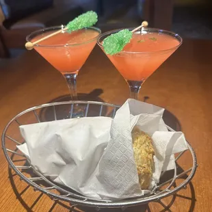 two cocktails with garnish garnish garnish garnish garnish garnish garn