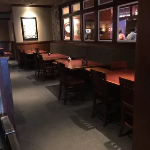 Wide open and empty, at least 10 groups waiting to be seated