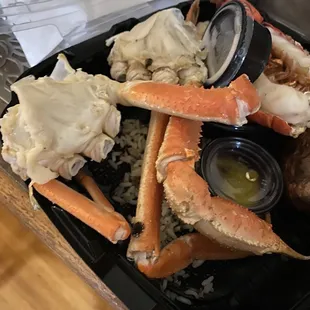 crab legs, rice, and other seafood items