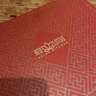 a close up of a red book