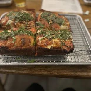 a pizza on a cooling rack