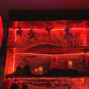 a bar with red lighting