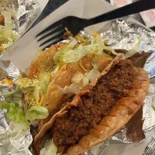 Spicy pork taco on left and chorizo taco on right. Jam packed! Great tacos!