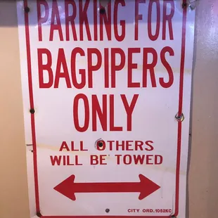 a parking for bagpipers only sign