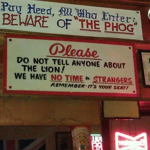 a sign that reads please don&apos;t tell anyone about the sign